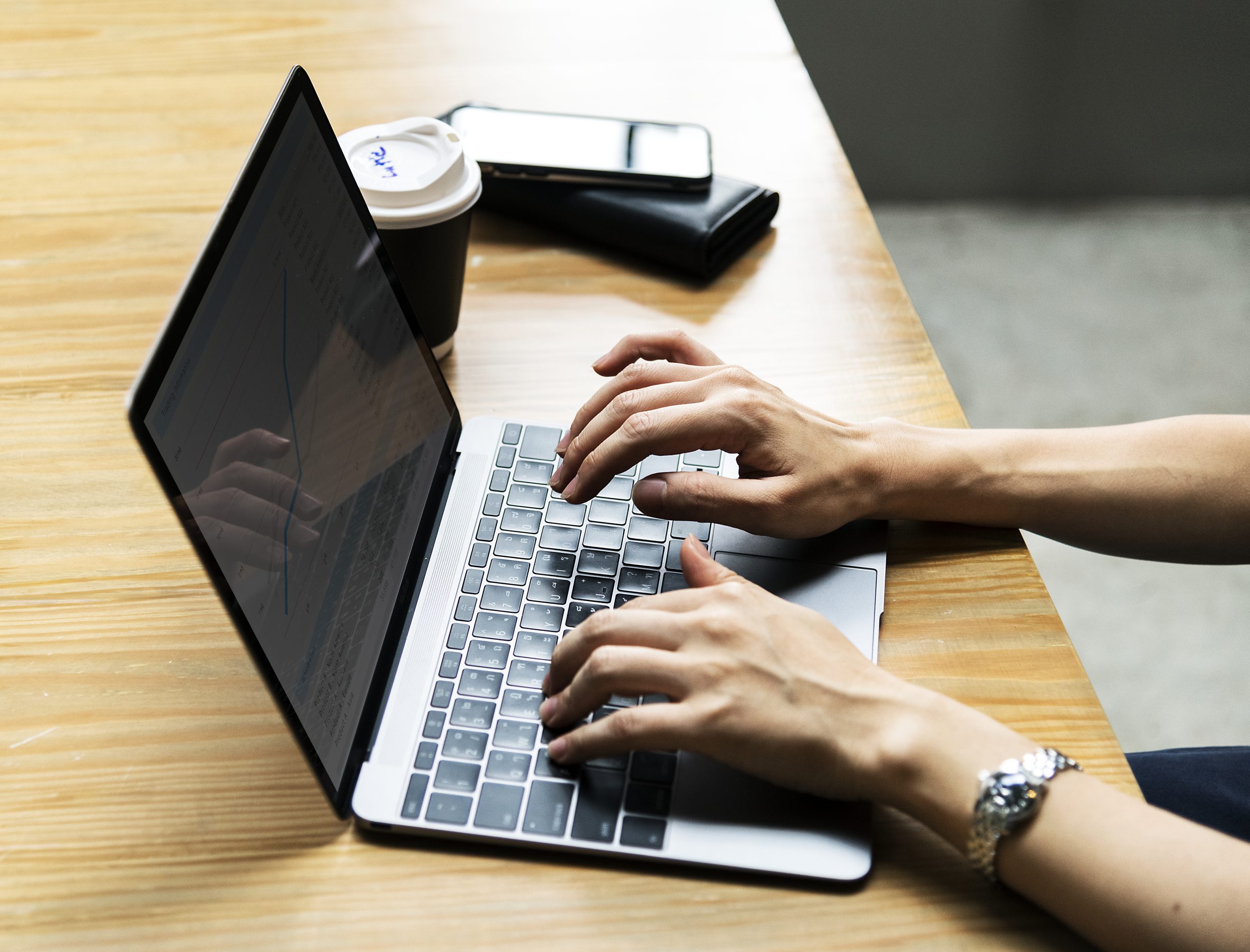 Woman using laptop for paraphrasing service